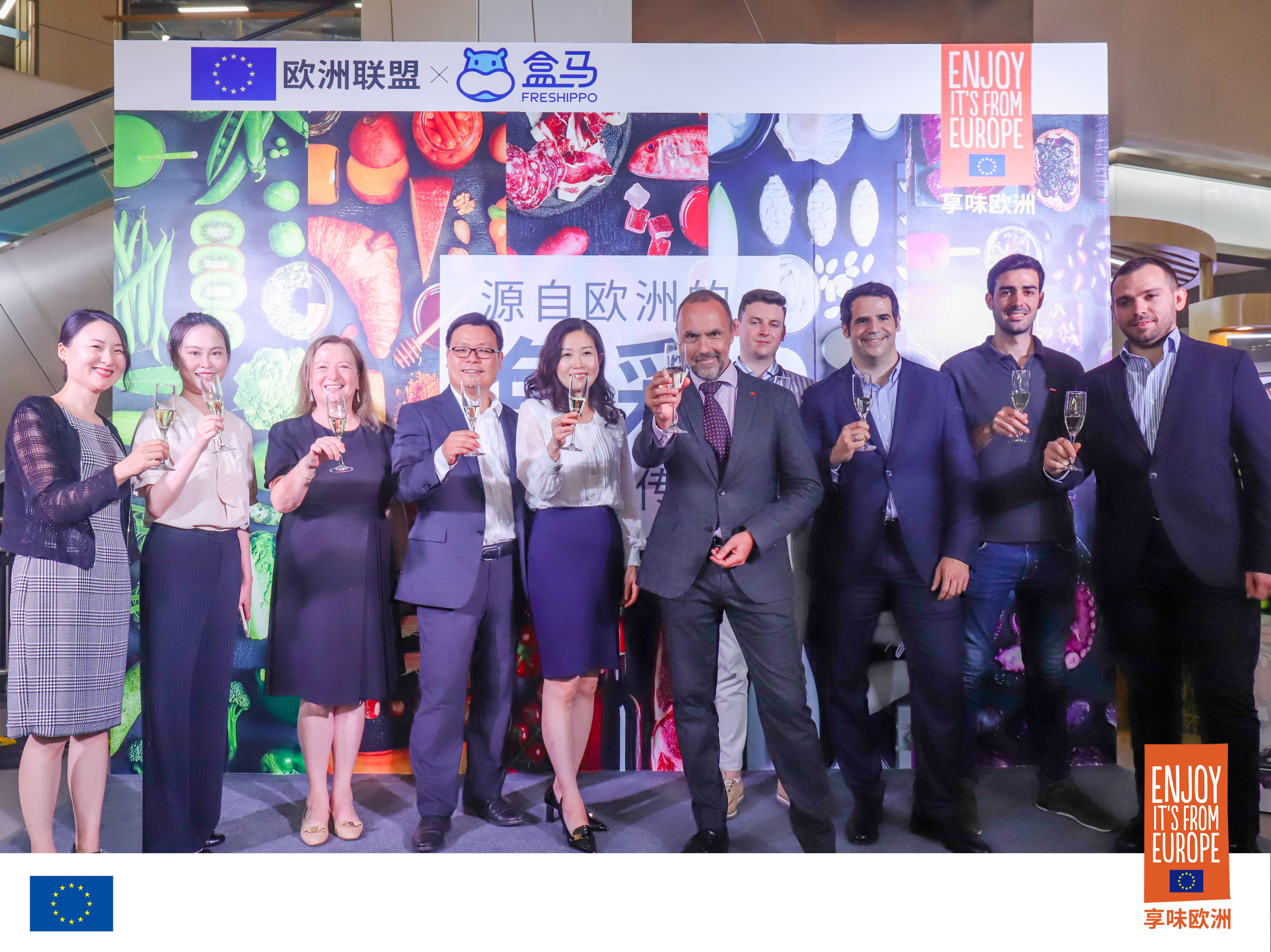 Chinese and EU representatives raising glasses. 