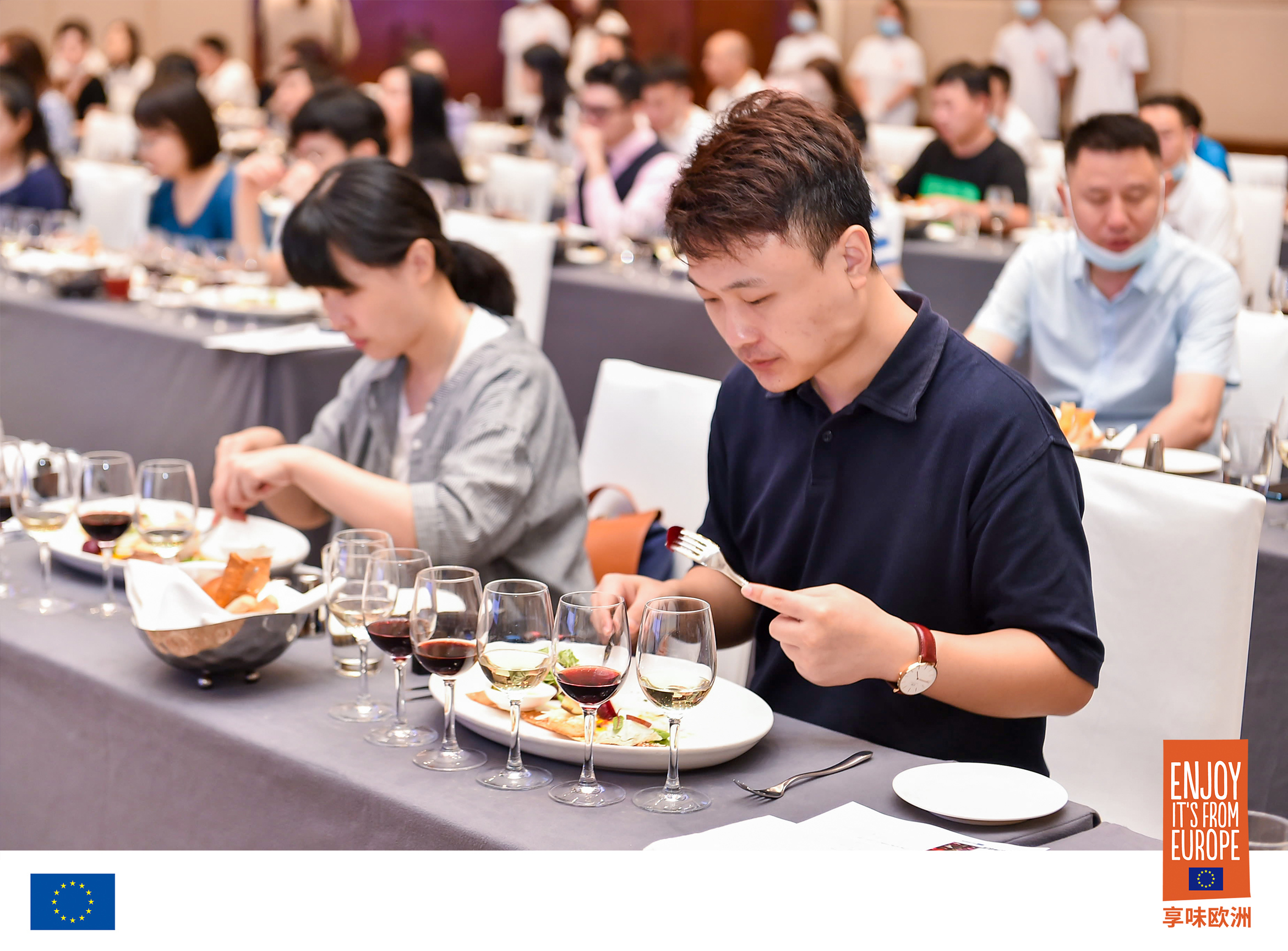 Participants tasting dishes and wine.