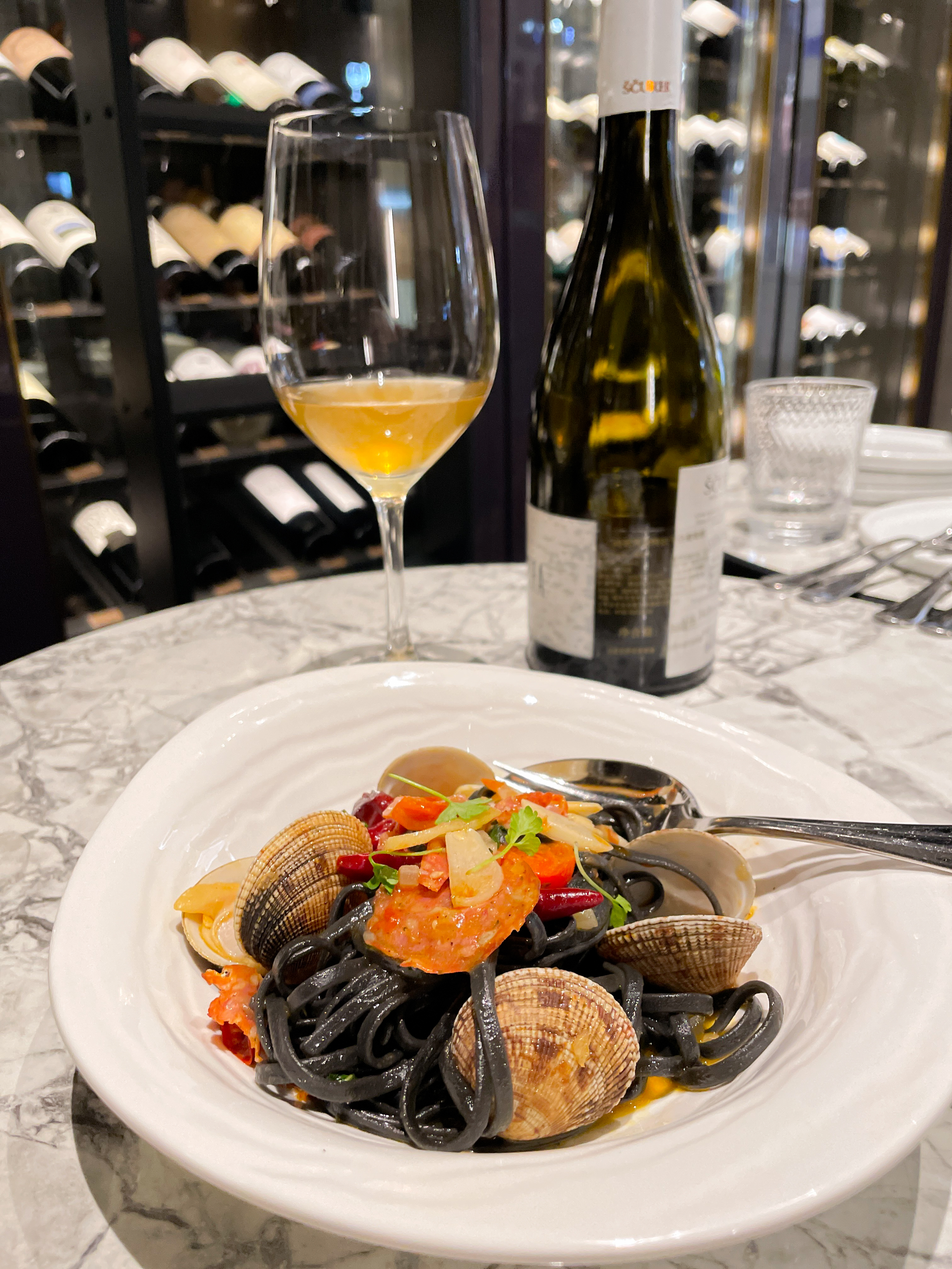 Pasta with sea food served with white wine. 