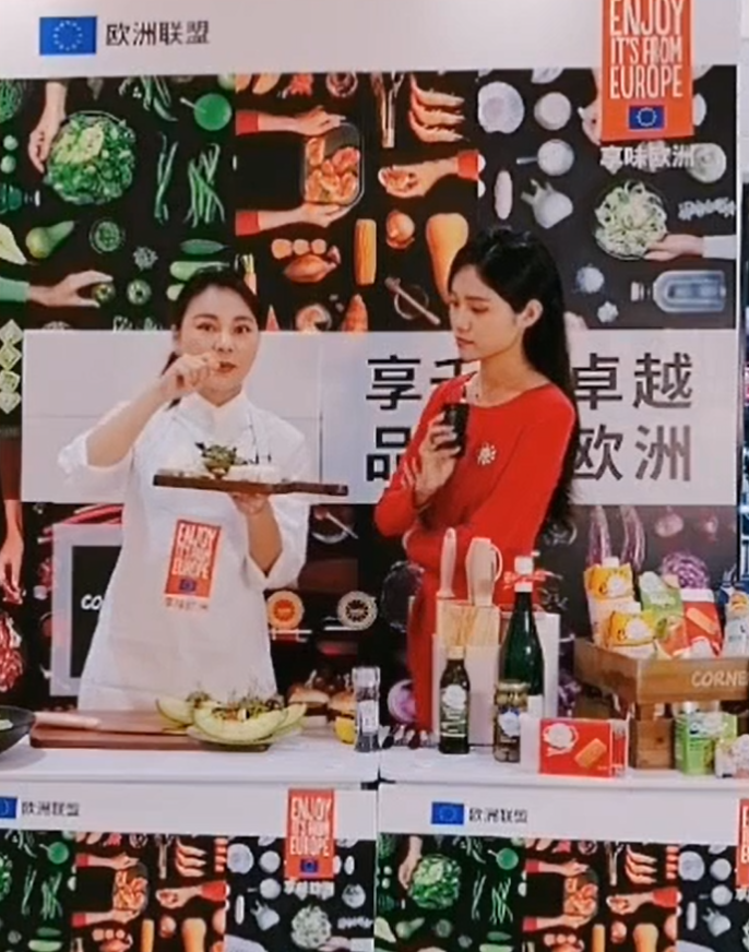 Two female presenters with EU products. 